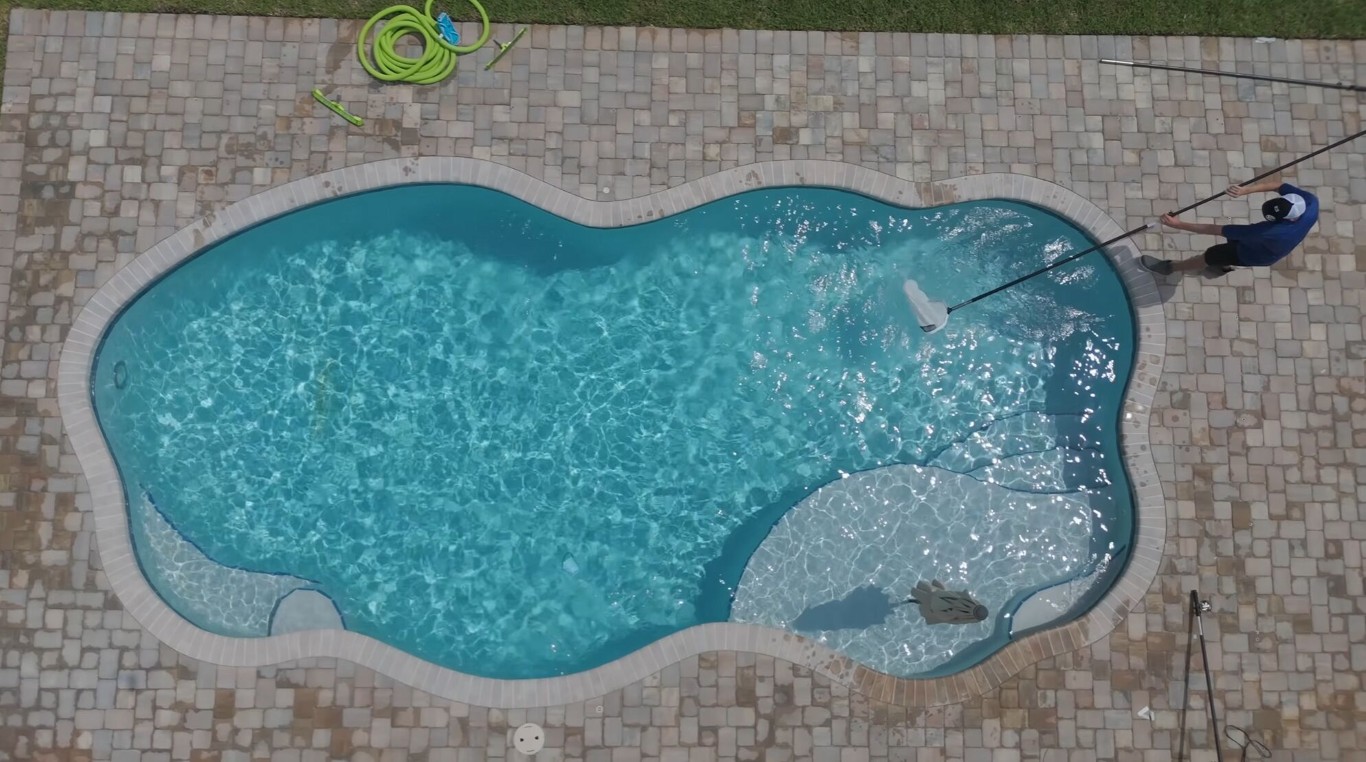 Aerial view of sparkling clean pool with professional maintenance in Miami Gardens, FL